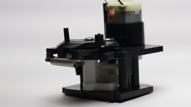 RC car steering mechanism with dc motor and gears working on battery power