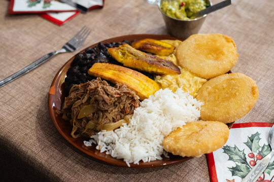 A traditional Venezuelan dish with rice, arepas, plantains, , and meat