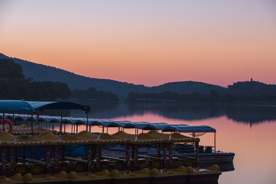 Sunrise over Xuanwu Lake with pedal boats in Nanjing, China