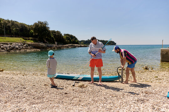 Family resting by the sea
