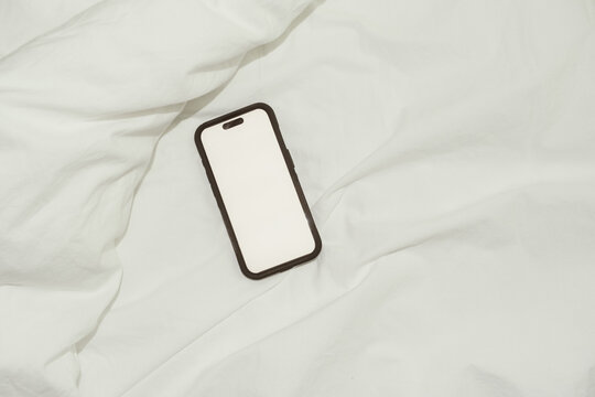 Blank Screen Phone Mockup on Bed