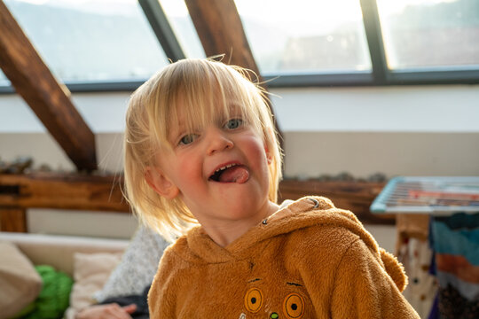 Little girl twisting her tongue 