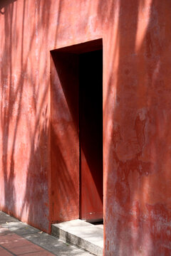 Red Wall Doorway Shadow Play
