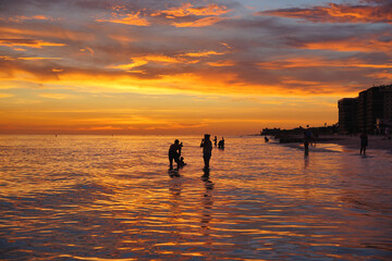 Fototapeta premium St Petersburg, Florida, USA: 07 03 2026: The landscape of saint Petersburg Madeira Beach in Florida at sun set at gulf of mexico