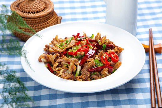 Spicy Stir Fried Pork with Chili Peppers on White Plate