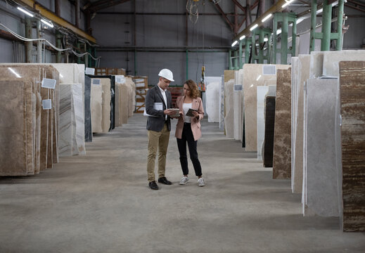 Male manager showing marble to client