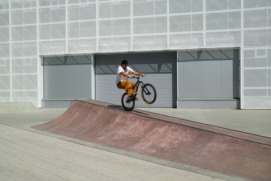 Extreme Bicycle Sport In Minimalistic Modern Skate Park