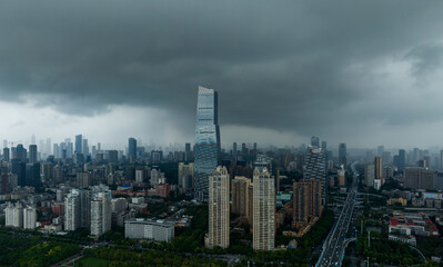 Fototapeta premium Wuhan City Skyline with Dark Storm Clouds and Panoramic View