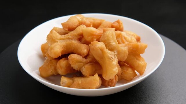 Deep fried dough stick,Chinese cruller or Chinese doughnut in white plate