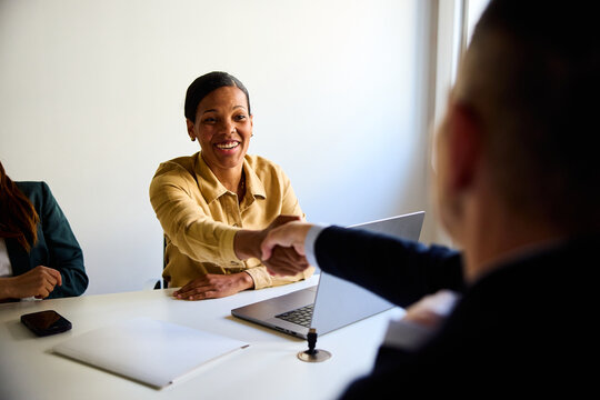 Woman greets a candidate at the interview