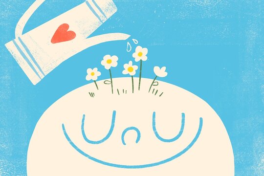 Happy child with flowers on his head watered with a watering pot