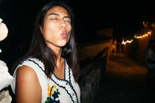 Woman Puckering Lips Outdoors