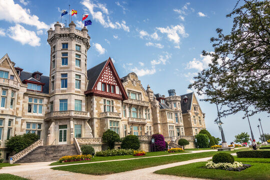 Santander, Spain - July 29, 2024: View of the facade of the Palacio de La Magdalena and its gardens in Santander, Spain, on a summer day.