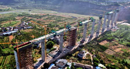 High-Speed Railway Bridge Construction Aerial View Over River Valley © LeVan