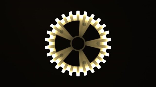 Moving gears create patterns in a dark space with light