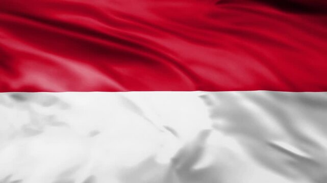 Waving flag of monaco with red and white horizontal stripes in wind against smooth motion background.