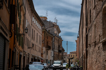 Obraz premium Narrow Historic Street with Traditional Buildings in an Italian City
