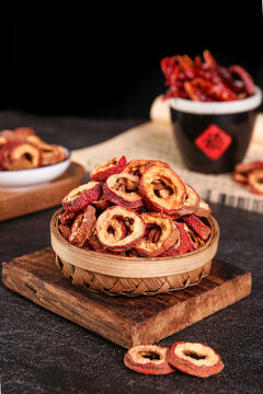 Traditional Chinese Dried Hawthorn Fruit Slices in Bamboo Basket Studio Food Photography