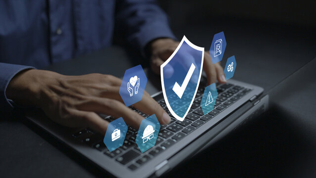 Work safety concept. Person using laptop with workplace safety and compliance icons, occupational health, risk prevention and employee protection.