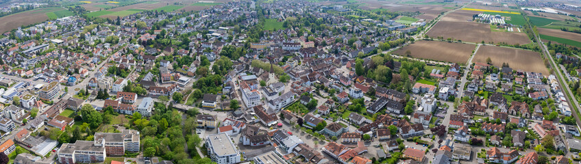 Obraz premium Aerial view beside the old town above the city Bad Krozingen, in south Germany on a sunny spring noon.
