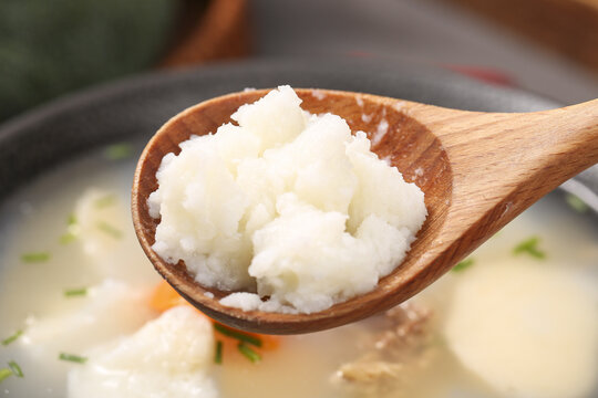 Chinese Mountain Yam Huaishan on Wooden Spoon - Traditional Yunnan Cooking Ingredient