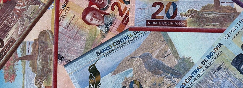 Bolivian boliviano money bills in pile. Big amount of Bolivia BOB currency cash close up