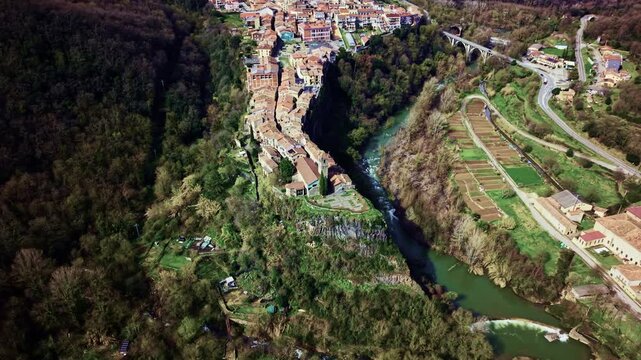 Wide aerial view of Castellfollit de la Roca surrounded by mountain valley