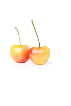 Fresh Golden Rainier Cherries Imported Chilean Fruit on White Background