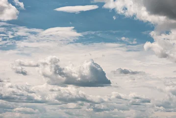 Clouds in the blue sky, different layers of clouds © Yulia