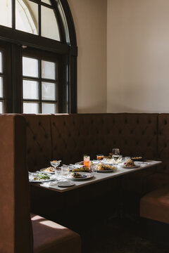Restaurant Table with Food and Cocktails