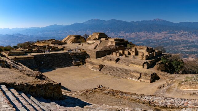 Ancient Zapotec site with stone platforms and staircases from an overlook