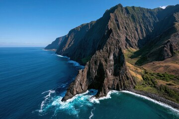 Fototapeta premium Molokai dramatic sea cliffs under a bright blue daytime sky