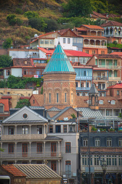 Surb Gevorg Armenian church in Old Tbilisi with traditional houses and copy space