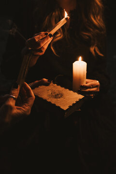 Woman Holding Candle and Incense 