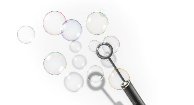 Soap bubbles floating from a bubble wand toy for childhood leisure activity on clean white background with bubble game childhood fun summer activity simple pleasures transparent spheres