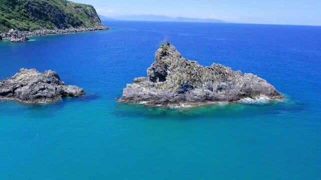Ulivarella Beach and Ulivo Rock aerial view in slow motion, Calabria, Italy