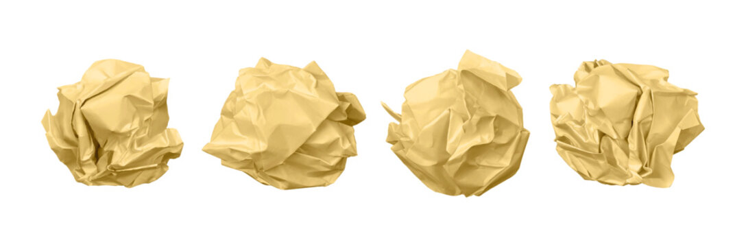 Set of four crumpled yellow paper balls isolated on a white background representing creative failure frustration and discarded ideas for business concepts