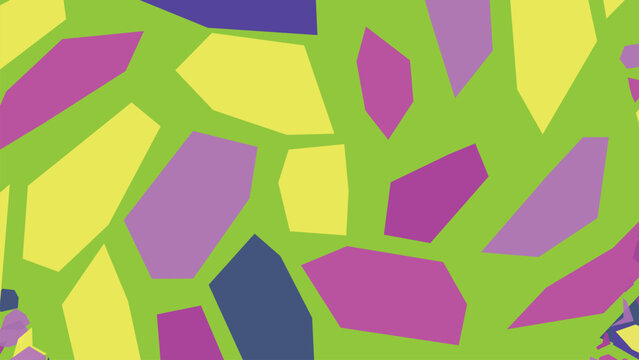 Colorful mosaic pattern featuring irregular polygon shapes in bright shades arranged across green surface as playful artistic design texture.