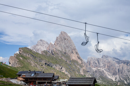 Seceda mountain landscape displaying chairlift, hut, and dolomites peaks
