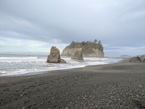 Dramatic view of Abbey Island and sea stacks on the dark sand coast of Ruby Beach Washington