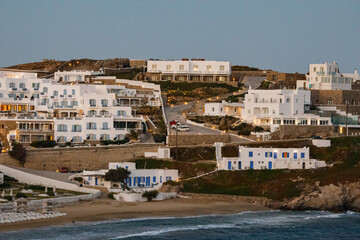 Obraz premium Greek Island Resort Coastal Village Dusk White Cycladic Houses Blue Accents