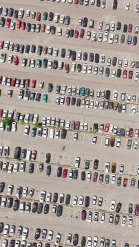 Aerial view of a car impound lot with damaged cars after an accident or towed for illegal parking.