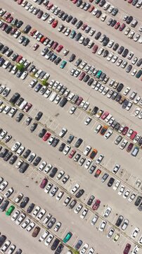Aerial view of a car impound lot with damaged cars after an accident or towed for illegal parking.