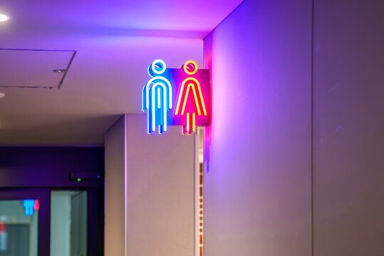 Neon restroom bathroom sign inside of a store