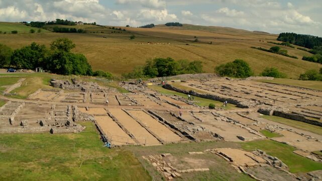 Aerial view moving over the Vindolanda Roman fort and archaeological site near Hadrian's Wall