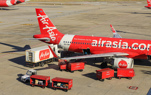 Don-Mueang International, Airport baggage tug (baggage dolly transport) on duty during ground handling services.