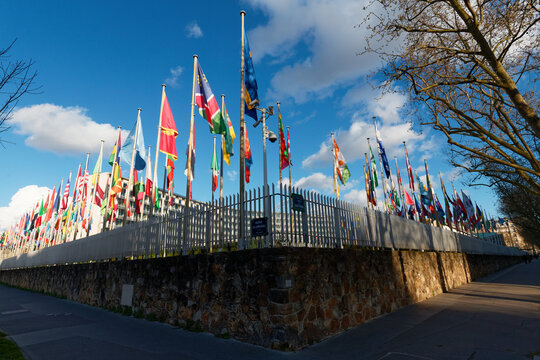 Paris, France - March 15, 2026 : Flags fluttering in the wind in front of the UNESCO (United Nations Educational, Scientific and Cultural Organization) headquarters at place de Fontenoy in Paris.