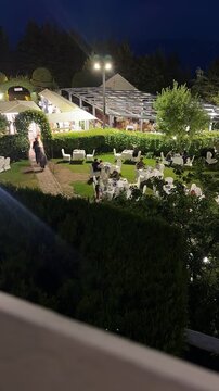 A timelapse footage of people in an open air restaurant. DInner buffet. 