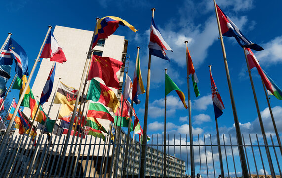 Paris, France - March 15, 2026 : Flags fluttering in the wind in front of the UNESCO (United Nations Educational, Scientific and Cultural Organization) headquarters at place de Fontenoy in Paris.