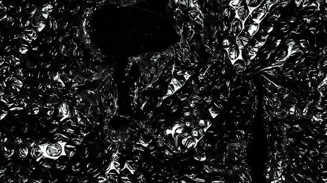 Dark Glossy Bubble Wrap Plastic Texture with Transparent Wrinkled Packaging Film, Realistic Protective Material Background Animation for Motion Graphics and Product Advertising